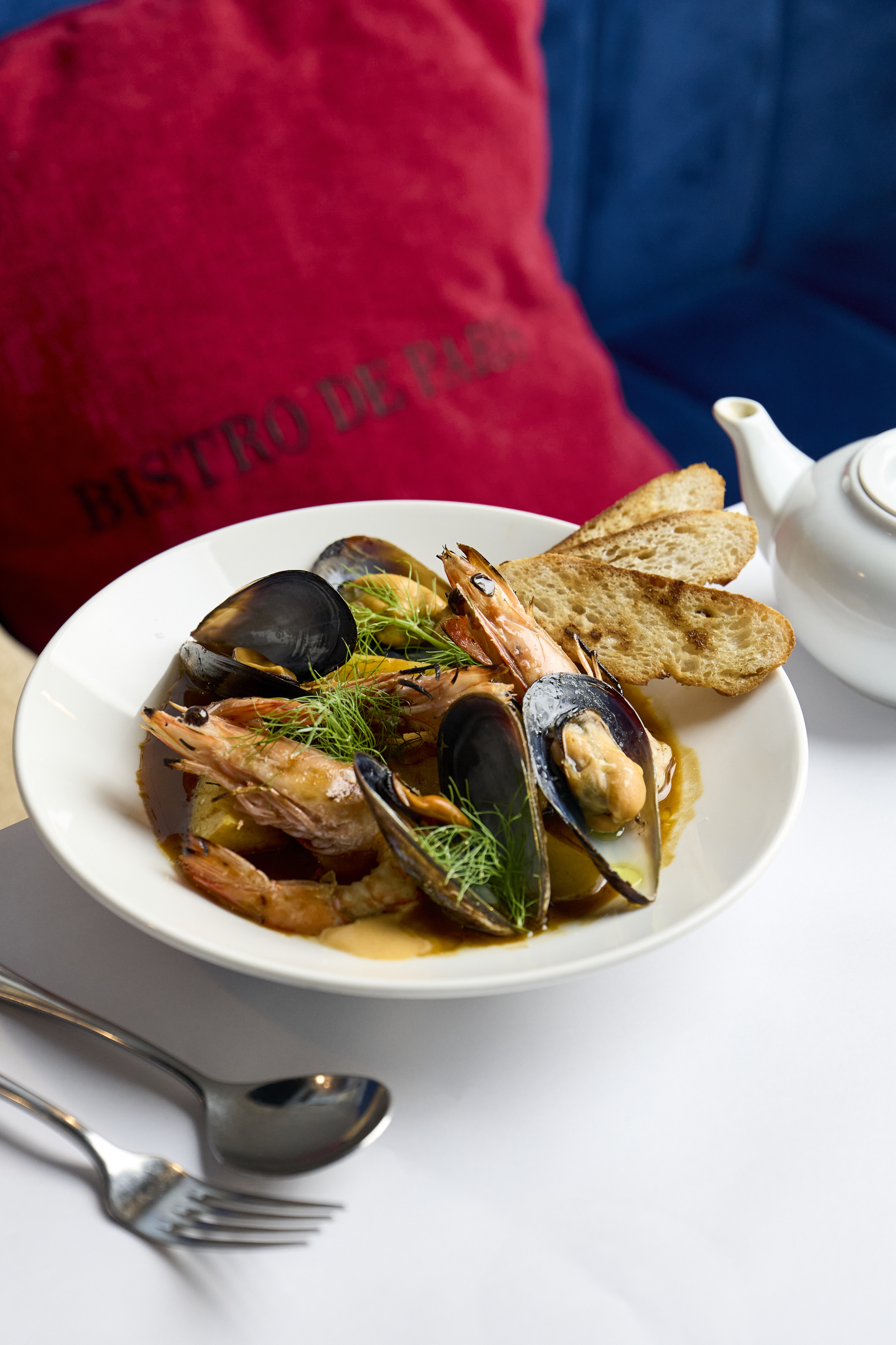 Chettinad Chicken Curry slow-cooked in a deep spiced gravy with red chillies and coriander in a karahi