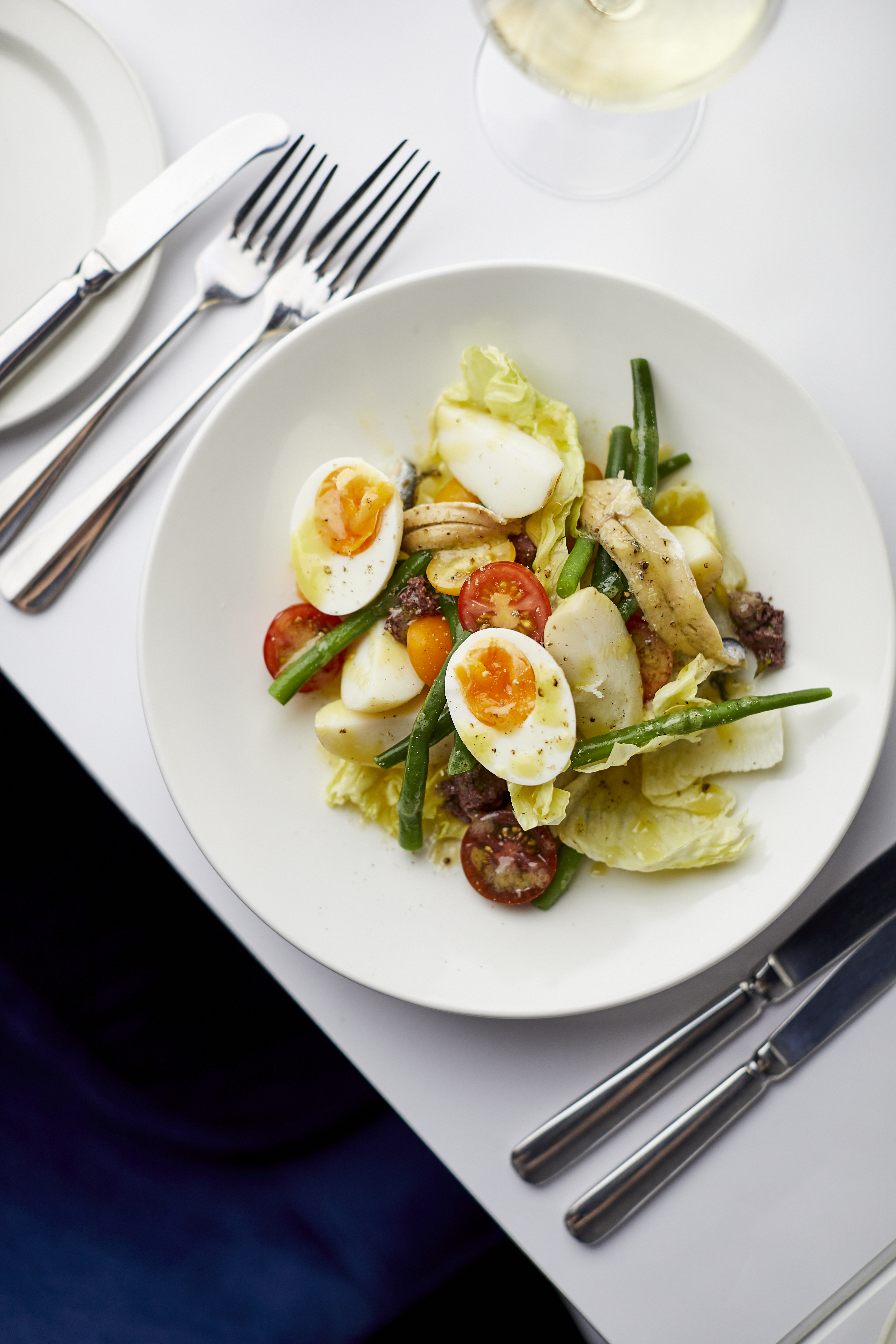 Traditional South Indian dish presented with aromatic garnishes and fresh accompaniments