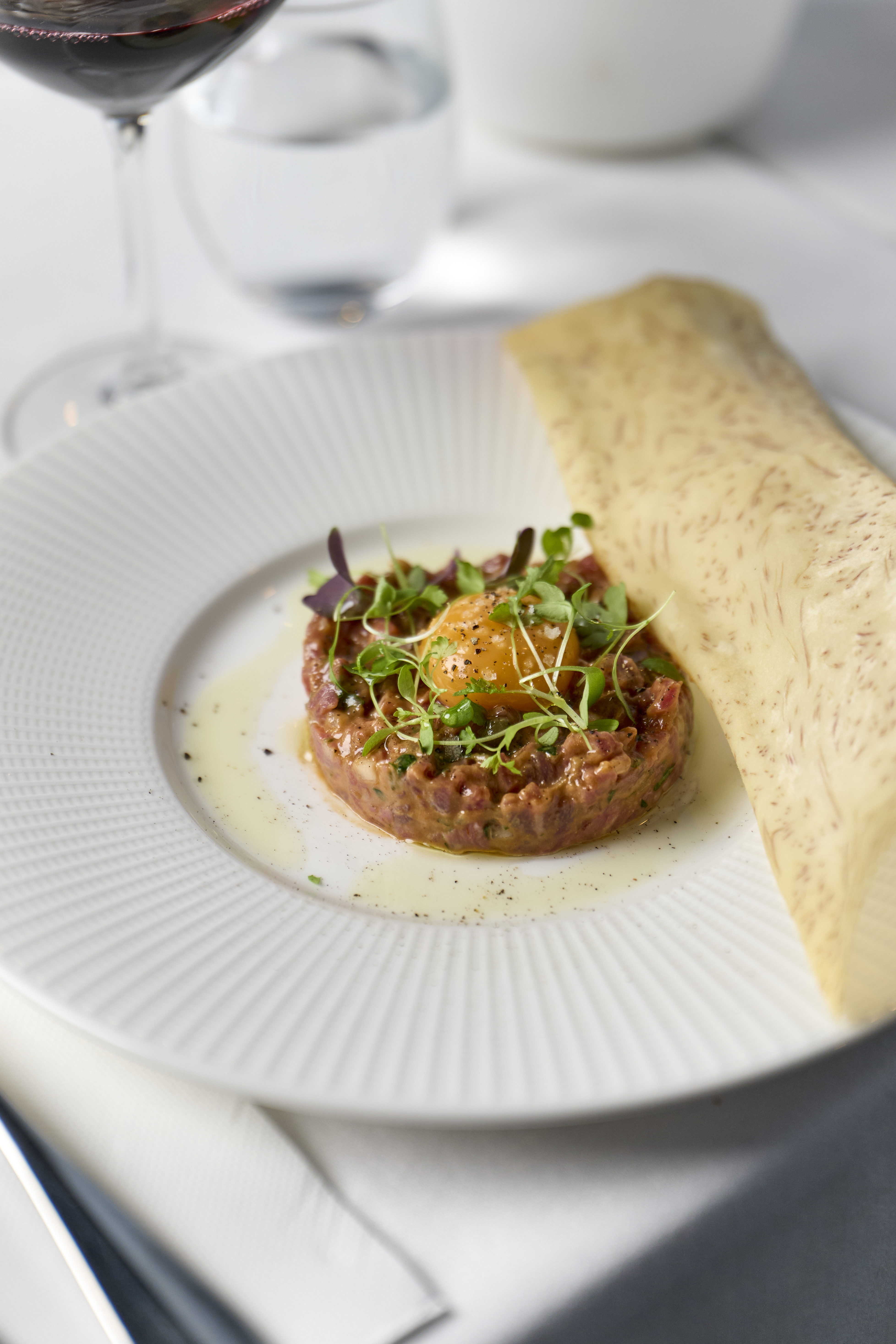 Vibrant curry dish with a medley of fresh herbs and traditional tempering
